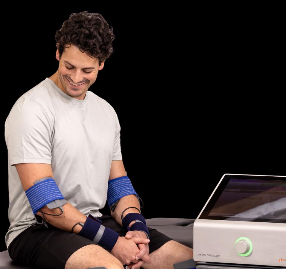 Manufacturer treatment illustration: HiToP treatment with electrodes on the wrists and forearms.