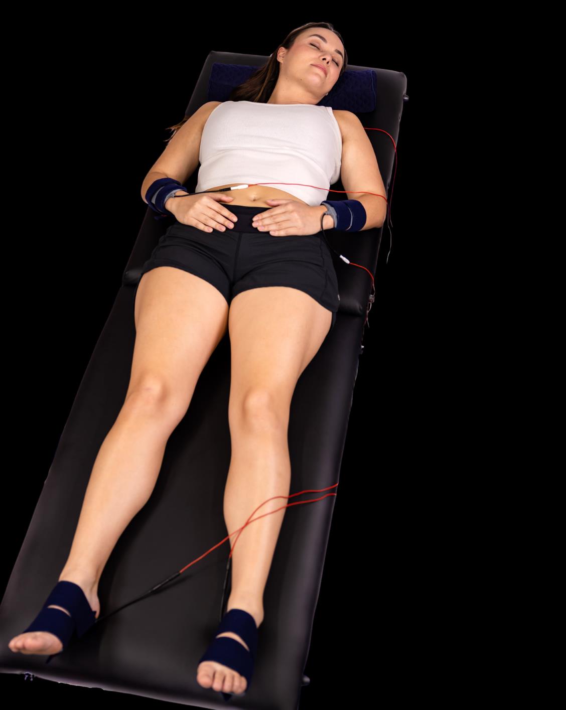 Manufacturer treatment illustration: Resting whole-body HiToP treatment with wrist and foot electrodes.