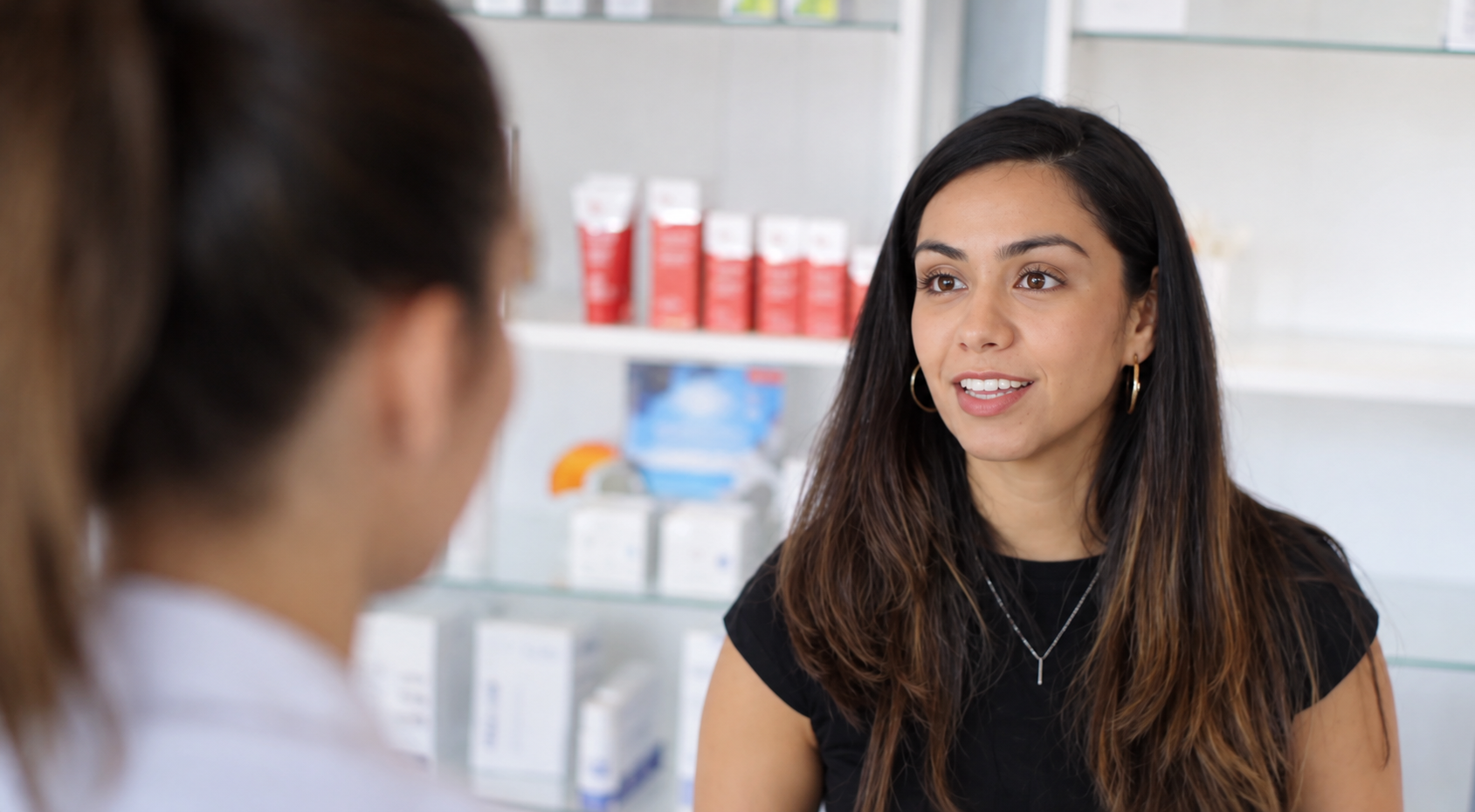 Professional woman in conversation with a colleague