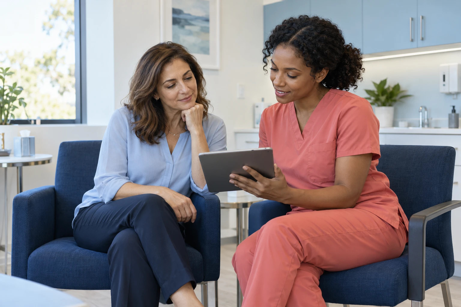 Illustrative staff member reviewing treatment goals with a patient at a medical office